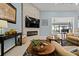 Bright living room with comfortable furniture, modern decor, and easy access to outdoor lanai at 1446 Stone Trl, Enterprise, FL 32725