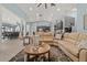 Inviting living room with comfortable seating, open to the kitchen and dining area at 1446 Stone Trl, Enterprise, FL 32725
