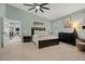 Lovely main bedroom featuring modern furniture, an open doorway to a dining area and neutral decor at 1446 Stone Trl, Enterprise, FL 32725