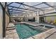 Relaxing screened-in pool area, complete with a gazebo, patio furniture, and connected to the home with sliding glass doors at 1446 Stone Trl, Enterprise, FL 32725