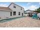 Beautiful backyard with a sparkling pool, patio, and tiki bar, perfect for outdoor relaxation and entertaining at 1491 Nappa Dr, Port Orange, FL 32128