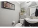 Cozy bathroom with modern vanity, decorative mirror, and stylish accents offers a touch of elegance at 1491 Nappa Dr, Port Orange, FL 32128