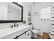 Bright bathroom with black accents, sliding door vanity and decorative accents creating a peaceful atmosphere at 1491 Nappa Dr, Port Orange, FL 32128