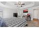 Large bedroom with an office space, ceiling fan, and a view into the ensuite bathroom at 1491 Nappa Dr, Port Orange, FL 32128