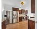 Well-equipped kitchen featuring stainless steel appliances, dark wood cabinets, and granite countertops at 1491 Nappa Dr, Port Orange, FL 32128