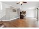 Open-concept living room featuring hardwood floors and a view into the kitchen and access to the backyard at 1491 Nappa Dr, Port Orange, FL 32128