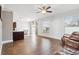 Bright living room features hardwood floors and a ceiling fan, offering comfortable space to relax and entertain at 1491 Nappa Dr, Port Orange, FL 32128