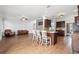 Spacious living room with hardwood floors, a kitchen bar, and comfortable seating arrangements at 1491 Nappa Dr, Port Orange, FL 32128
