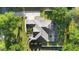Birds-eye view of a well-maintained property showcasing the roof, driveway, and landscaping at 1523 Red Plum Holw, Deland, FL 32720