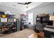 Cluttered bedroom with carpet and shelving units for storage at 1523 Red Plum Holw, Deland, FL 32720