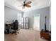 Simple bedroom featuring a carpet, fan, and a small desk with a computer at 1523 Red Plum Holw, Deland, FL 32720