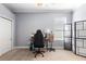Well-lit bedroom featuring a desk, gaming chair, and a decorative screen at 1523 Red Plum Holw, Deland, FL 32720