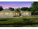 Charming home featuring well-manicured lawn and attractive blue double-door entrance, complemented by lush landscaping at 1523 Red Plum Holw, Deland, FL 32720
