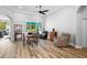 Living area with wood floors, neutral tones, and views of the outdoor space through large sliding glass doors at 1523 Red Plum Holw, Deland, FL 32720