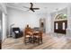 Cozy living area with wood floors, neutral colors, and comfortable seating arrangements at 1523 Red Plum Holw, Deland, FL 32720