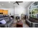 Inviting living room featuring a modern fireplace and wood flooring at 1523 Red Plum Holw, Deland, FL 32720