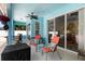 Inviting covered patio with comfortable seating and a ceiling fan at 1523 Red Plum Holw, Deland, FL 32720