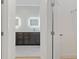 Modern bathroom featuring double sinks, dark wood cabinets, and elegant design at 156 N Cory Dr, Edgewater, FL 32141