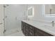 Luxurious bathroom with walk-in shower, double sinks, modern lighting, and stylish finishes at 156 N Cory Dr, Edgewater, FL 32141