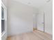 Inviting room with wood flooring, natural light from a window and white door at 156 N Cory Dr, Edgewater, FL 32141