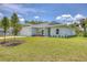 Charming single-story home with a well-manicured lawn and two-car garage at 156 N Cory Dr, Edgewater, FL 32141