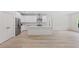 Bright kitchen with white cabinets, stainless appliances, and a functional center island at 156 N Cory Dr, Edgewater, FL 32141