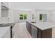 Bright kitchen with modern appliances, light countertops, and ample natural light at 156 N Cory Dr, Edgewater, FL 32141