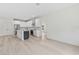 Modern kitchen with white cabinetry, stainless steel appliances, and central island at 156 N Cory Dr, Edgewater, FL 32141