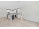 Modern kitchen with white cabinetry, stainless steel appliances, and central island at 156 N Cory Dr, Edgewater, FL 32141
