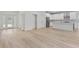Spacious open-concept living area with durable and attractive wood-look flooring at 156 N Cory Dr, Edgewater, FL 32141