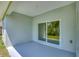 Inviting covered patio with a view of tropical landscaping at 156 N Cory Dr, Edgewater, FL 32141