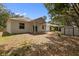 Home exterior with covered porch, large yard, and storage shed at 15733 Green Point Ct, Clermont, FL 34714