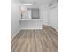 Bright living space featuring a kitchen and dining area and a laminate wood floor at 15733 Green Point Ct, Clermont, FL 34714