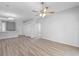 Open-concept living space with access to the kitchen, storage and outdoor areas at 15733 Green Point Ct, Clermont, FL 34714