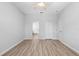 Bedroom featuring wood flooring, neutral walls, ceiling fan, closet, and ensuite bathroom at 15733 Green Point Ct, Clermont, FL 34714
