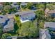 Charming white two-story home featuring a gray roof and lush landscaping in a desirable neighborhood at 1613 Crescent Ridge Rd, Daytona Beach, FL 32118
