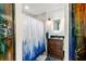 Bathroom featuring a modern vanity with a granite countertop and a shower with stylish curtain at 1613 Crescent Ridge Rd, Daytona Beach, FL 32118