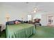 Bright bedroom with a ceiling fan and large window at 1613 Crescent Ridge Rd, Daytona Beach, FL 32118
