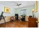 Bedroom with light green walls, built-in desk, and ceiling fan at 1613 Crescent Ridge Rd, Daytona Beach, FL 32118