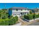 Attractive home featuring a two-car garage, well-kept landscaping, and a classic white exterior on a sunny day with blue sky at 1613 Crescent Ridge Rd, Daytona Beach, FL 32118