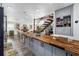 Open-concept kitchen with butcher block island and an airy connection to the main living spaces at 1613 Crescent Ridge Rd, Daytona Beach, FL 32118