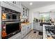 Updated kitchen features stainless steel oven, granite countertops and light gray cabinets at 1613 Crescent Ridge Rd, Daytona Beach, FL 32118