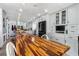 Spacious kitchen with light grey cabinetry, modern appliances, and a large island for dining at 1613 Crescent Ridge Rd, Daytona Beach, FL 32118