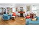 Cozy living room featuring hardwood floors, a fireplace, and eclectic decor with comfortable seating at 1613 Crescent Ridge Rd, Daytona Beach, FL 32118