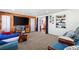 Large living room with carpeted floors and natural wood accent wall at 1613 Crescent Ridge Rd, Daytona Beach, FL 32118