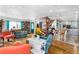 Bright living space with hardwood floors, an open layout, and a seamless connection to the kitchen at 1613 Crescent Ridge Rd, Daytona Beach, FL 32118