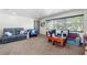Relaxing living room with comfortable seating and neutral carpet at 1613 Crescent Ridge Rd, Daytona Beach, FL 32118