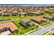 Bird's-eye view of a residential area featuring tile-roofed homes, scenic ponds, and well-maintained landscaping at 163 Rosa Bella Vw, Debary, FL 32713