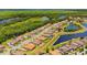 Stunning aerial shot showcases houses along a street with interspersed waterways, lush greenery, and dense trees at 163 Rosa Bella Vw, Debary, FL 32713