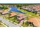 Expansive aerial view showcasing a community with waterfront homes, lush landscaping, and scenic ponds at 163 Rosa Bella Vw, Debary, FL 32713
